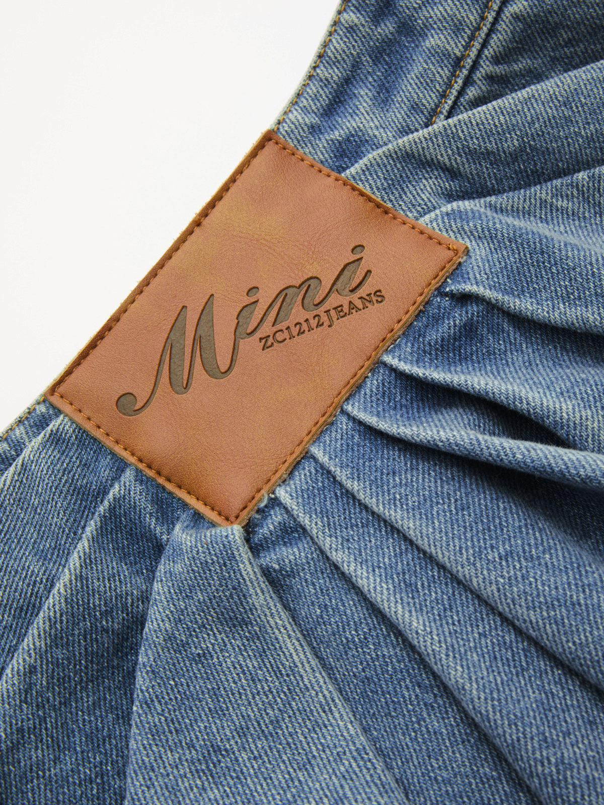 Asymmetric Pleated Denim Mini Skirt